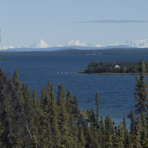 Snow capped mountains suround Alaska's Lake Louise.